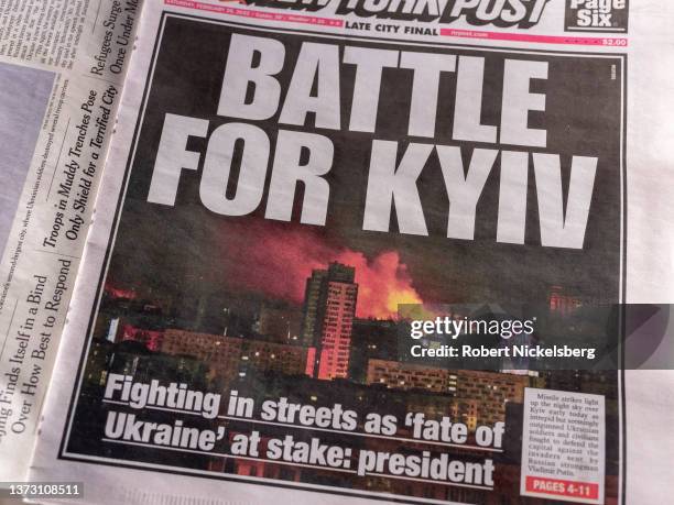 The front-page of the New York Post shows a picture of the night sky following a missile strike in Kyiv, Ukraine February 26, 2022 on a newsstand in...