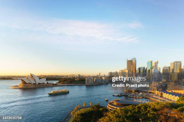 cityscape image of sydney with harbor bridge and famous landmark and business office building skyscraper and skyline at sydney, australia. - opera house stockfoto's en -beelden