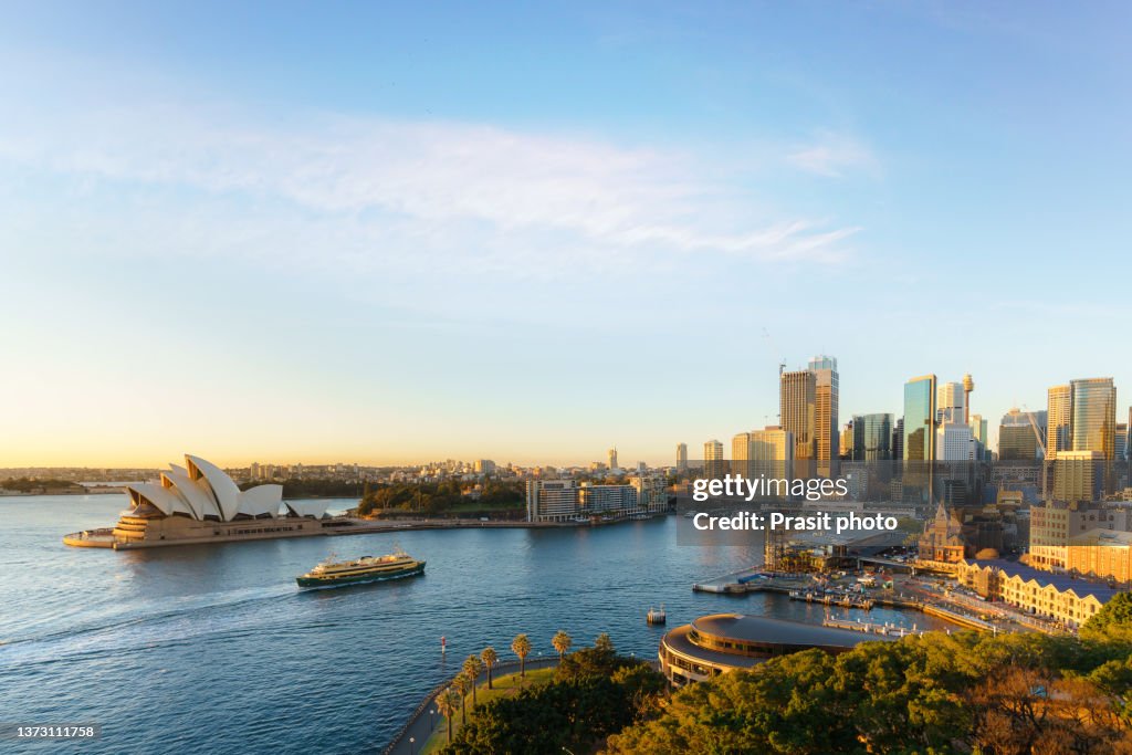 Cityscape image of Sydney with Harbor bridge and famous landmark and business office building skyscraper and skyline at Sydney, Australia.