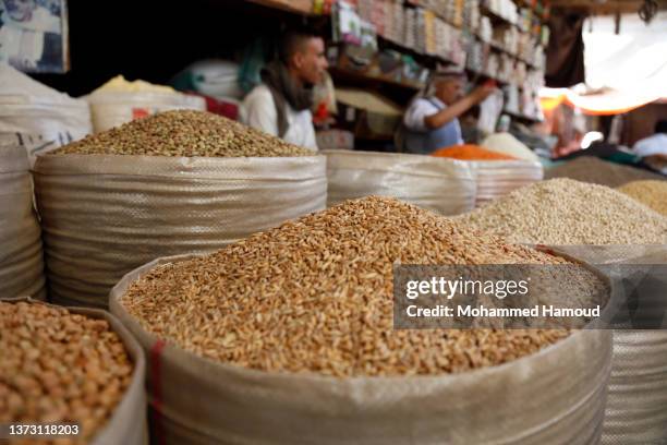 Yemenis shop to buy wheat, flour and daily basics from a popular market on February 27, 2022 in Sana'a Yemen. Whereas the level of hunger in Yemen,...