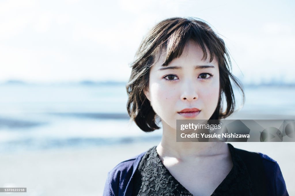 Woman looking at camera with serious face