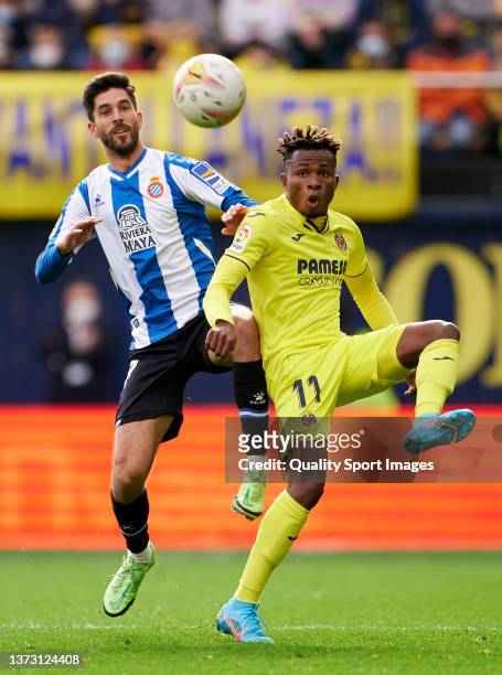 Samuel Chukwueze of Villarreal CF competes for the ball with Didac Vila of RCD Espanyol during the La Liga Santander match between Villarreal CF and...