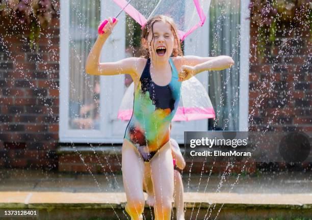 fun in the sun - british weather stock pictures, royalty-free photos & images