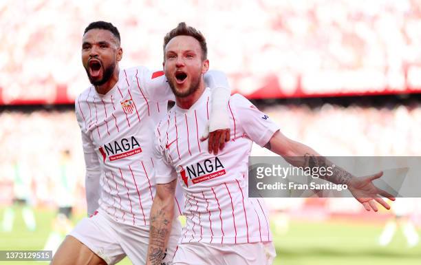 Ivan Rakitic celebrates with teammate Yousseff En-Nesyri of Sevilla FC after scoring their team's first goal during the LaLiga Santander match...