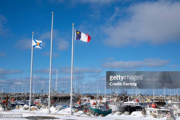 commercial fishing boats in meteghan, nova scotia, canada - flag of nova scotia stock pictures, royalty-free photos & images