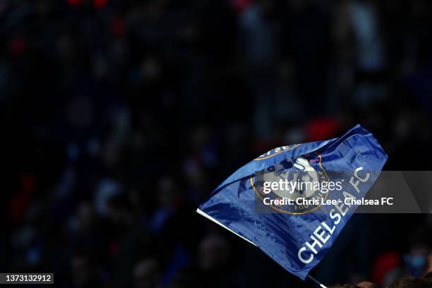 Chelsea fan waves a flag prior to the Carabao Cup Final match between Chelsea and Liverpool at Wembley Stadium on February 27, 2022 in London,...