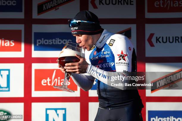 Fabio Jakobsen of Netherlands and Team Quick-Step - Alpha Vinyl celebrates at podium with a beer as race winner during the 74th Kuurne - Bruxelles -...