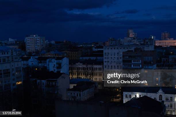 General view over the Kyiv skyline and residential buildings after sunset during a curfew imposed from Saturday 5 PM to Monday 8 AM local time on...