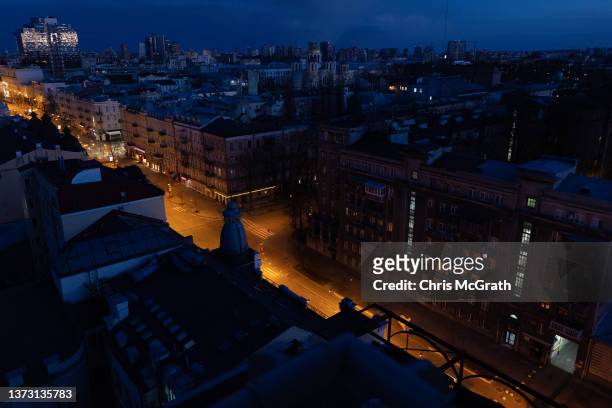 General view over the Kyiv skyline and residential buildings after sunset during a curfew imposed from Saturday 5 PM to Monday 8 AM local time on...