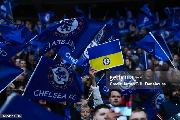Chelsea fans lift Ukraine flags during the Carabao Cup Final match between Chelsea and Liverpool at Wembley Stadium on February 27, 2022 in London,...