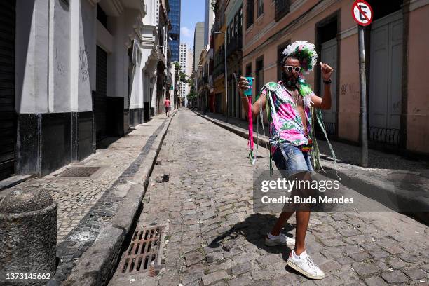 People part of carnival troupe celebrates Carnival Sunday in the downtown area on February 27, 2022 in Rio de Janeiro, Brazil. With the traditional...