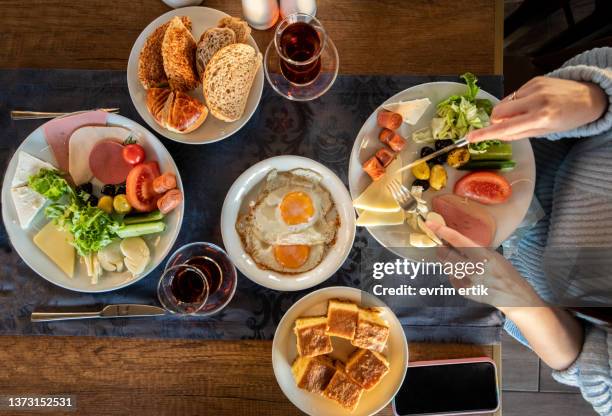 having delicious breakfast at restaurant - turkish ethnicity stock pictures, royalty-free photos & images