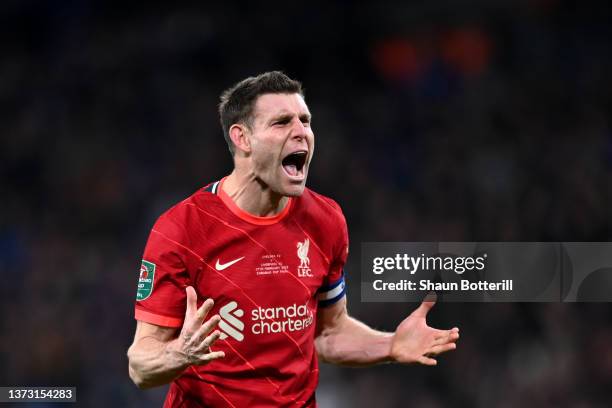 James Milner of Liverpool celebrates after scoring their side's first penalty in the penalty shoot out during the Carabao Cup Final match between...