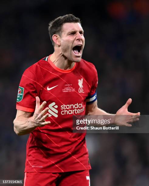 James Milner of Liverpool celebrates after scoring their side's first penalty in the penalty shoot out during the Carabao Cup Final match between...