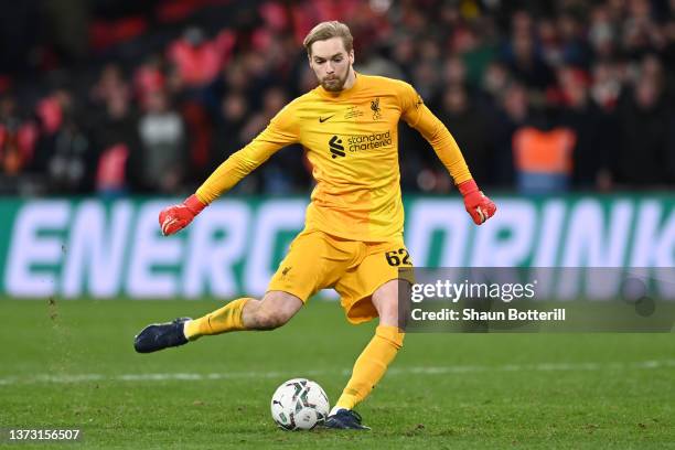 Caoimhin Kelleher of Liverpool scores their team's eleventh penalty in the penalty shoot out during the Carabao Cup Final match between Chelsea and...