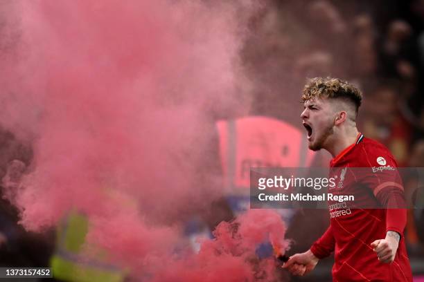Harvey Elliott of Liverpool celebrates with a red flare following their team's victory in the penalty shoot out during the Carabao Cup Final match...