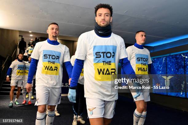 Felipe Anderson of SS Lazio wears a 'Stop the war' T-shirts referring to Russia's invasion of the Ukraine as they arrive to warm-up prior to the...