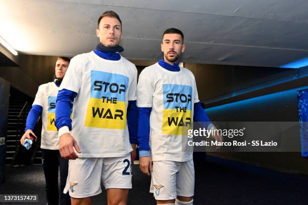 Stefan Radu and Mattia Zaccagni of SS Lazio wears a 'Stop the war' T-shirts referring to Russia's invasion of the Ukraine as they arrive to warm-up...