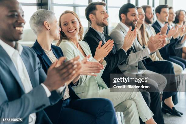 applause at business conference - awards press room stock pictures, royalty-free photos & images