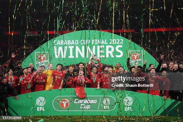 Jordan Henderson of Liverpool lifts the Carabao Cup trophy following victory in the Carabao Cup Final match between Chelsea and Liverpool at Wembley...