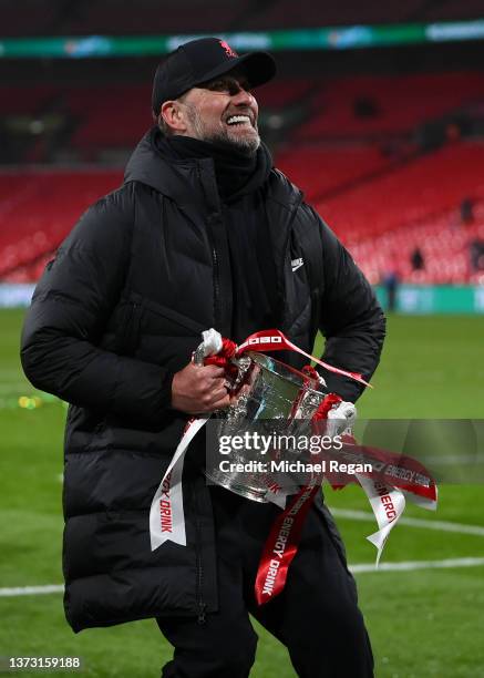 Juergen Klopp of Liverpool lifts The Carabao Cup trophy following their side's victory during the Carabao Cup Final match between Chelsea and...