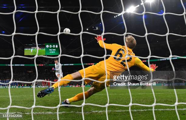 Kepa Arrizabalaga of Chelsea misses the deciding penalty in the penalty shoot out as Caoimhin Kelleher of Liverpool attempts to save during the...