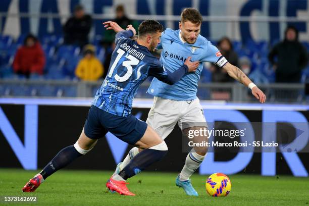 Ciro Immobile of SS Lazio compete for the ball with Amir Rrahmani of SSC Napoli during the Serie A match between SS Lazio and SSC Napoli at Stadio...