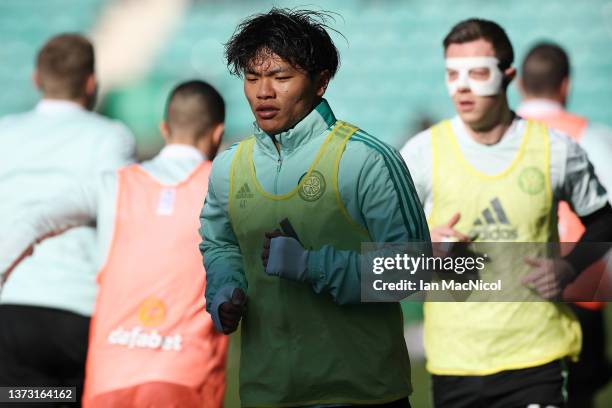 Reo Hatate of Celtic warms up during the Cinch Scottish Premiership match between Hibernian FC and Celtic FC at on February 27, 2022 in Edinburgh,...