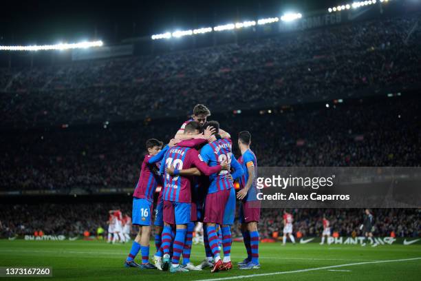 Pierre-Emerick Aubameyang celebrates with teammates after scoring his team's first goal during the LaLiga Santander match between FC Barcelona and...