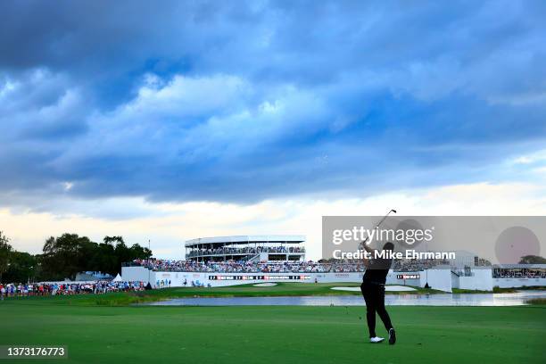 Shane Lowry of Ireland plays his shot on the 16th hole during the final round of The Honda Classic at PGA National Resort And Spa on February 27,...