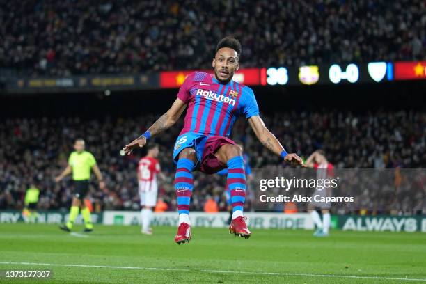 Pierre-Emerick Aubameyang celebrates after scoring his team's first goal during the LaLiga Santander match between FC Barcelona and Athletic Club at...