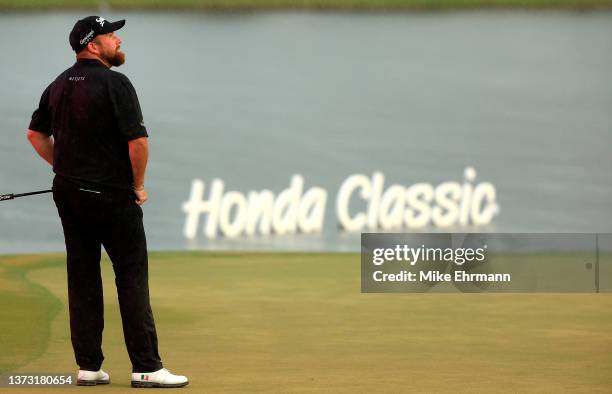 Shane Lowry of Ireland reacts to a missed putt on the 18th green during the final round of The Honda Classic at PGA National Resort And Spa on...