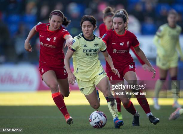 Mana Iwabuchi of Arsenal in action with Leighanne Robe and Leanne Kiernan of Liverpool during the Vitality Women's FA Cup Fifth Round match between...