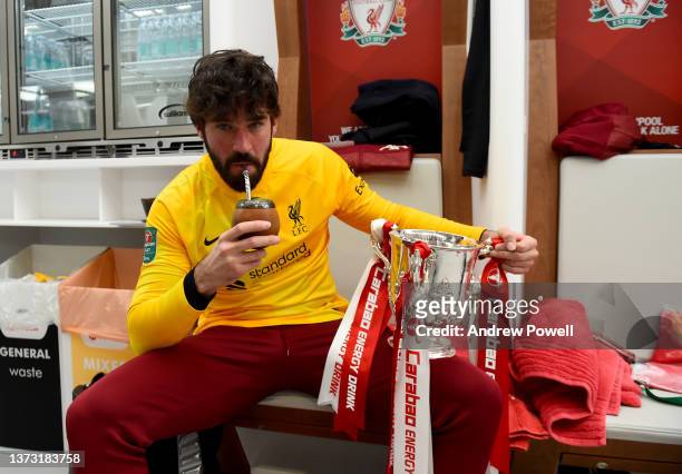 Alisson Becker of Liverpool with the EFL Carabao Cup trophy in the dressing room at the end of the Carabao Cup Final match between Chelsea and...