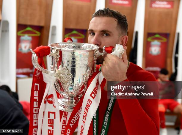 Jordan Henderson captain of Liverpool in the dressing room with the EFL Carabao Cup trophy at the end of the Carabao Cup Final match between Chelsea...