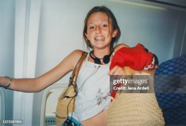 y2k fashion teen with braces, nervous woman in airplane 2000s style anxiety - sólo chicas adolescentes fotografías e imágenes de stock