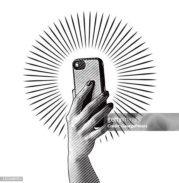 der frau hand halten smartphone - one finger selfie stock-grafiken, -clipart, -cartoons und -symbole