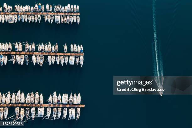 aerial drone view of luxury yacht marina. top view, lines, abstract and geometry background with copy space - spartan cruiser stock pictures, royalty-free photos & images