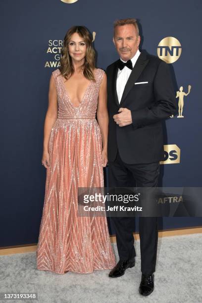 Kevin Costner and Christine Baumgartner attend the 28th Annual Screen Actors Guild Awards at Barker Hangar on February 27, 2022 in Santa Monica,...