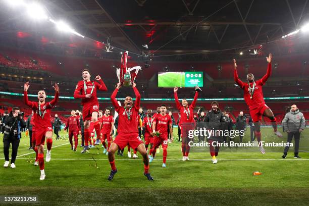 Joel Matip of Liverpool celebrates with the trophy following the Carabao Cup Final match between Chelsea and Liverpool at Wembley Stadium on February...