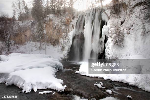 frozen spearfish falls in the black hills of south dakota - black hills south dakota stock pictures, royalty-free photos & images