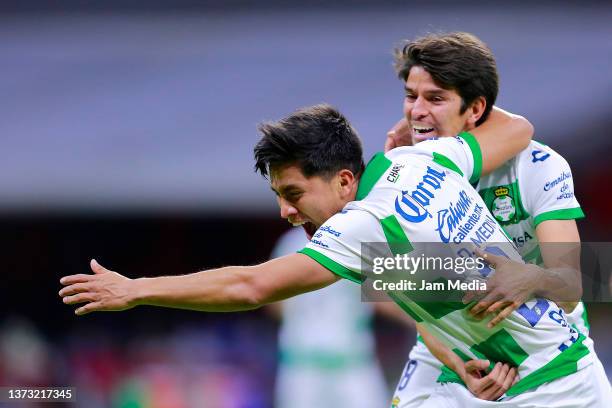 Diego Medina of Santos celebrates with Carlos Orrantia after scoring his team's second goal during the 7th round match between Cruz Azul and Santos...