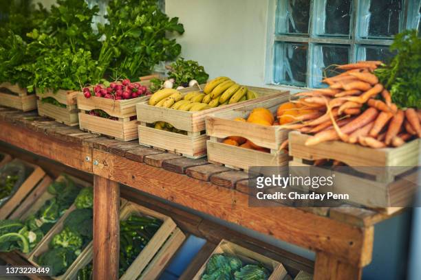 shot of freshly picked produce in a crate a farmer’s market - homegrown produce stock pictures, royalty-free photos & images