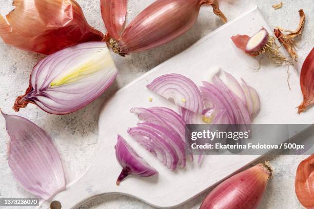 sliced red tropea onions on a white board top view - cutting red onion stock pictures, royalty-free photos & images