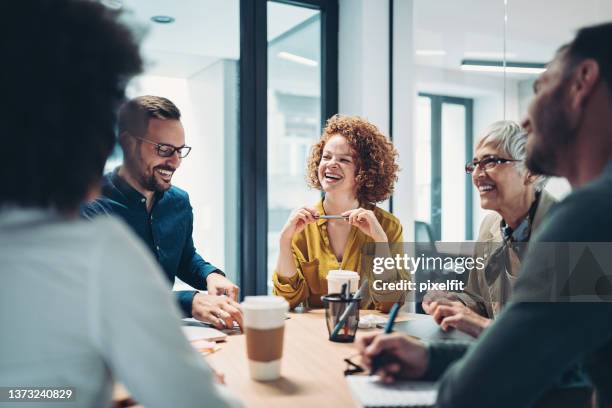 happy to be part of this successful team - happy laugh stockfoto's en -beelden