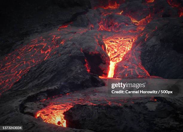 volcano lava with steam emitting smoke over volcanic crater,fagradalsfjall,iceland - fagradalsfjall stock pictures, royalty-free photos & images