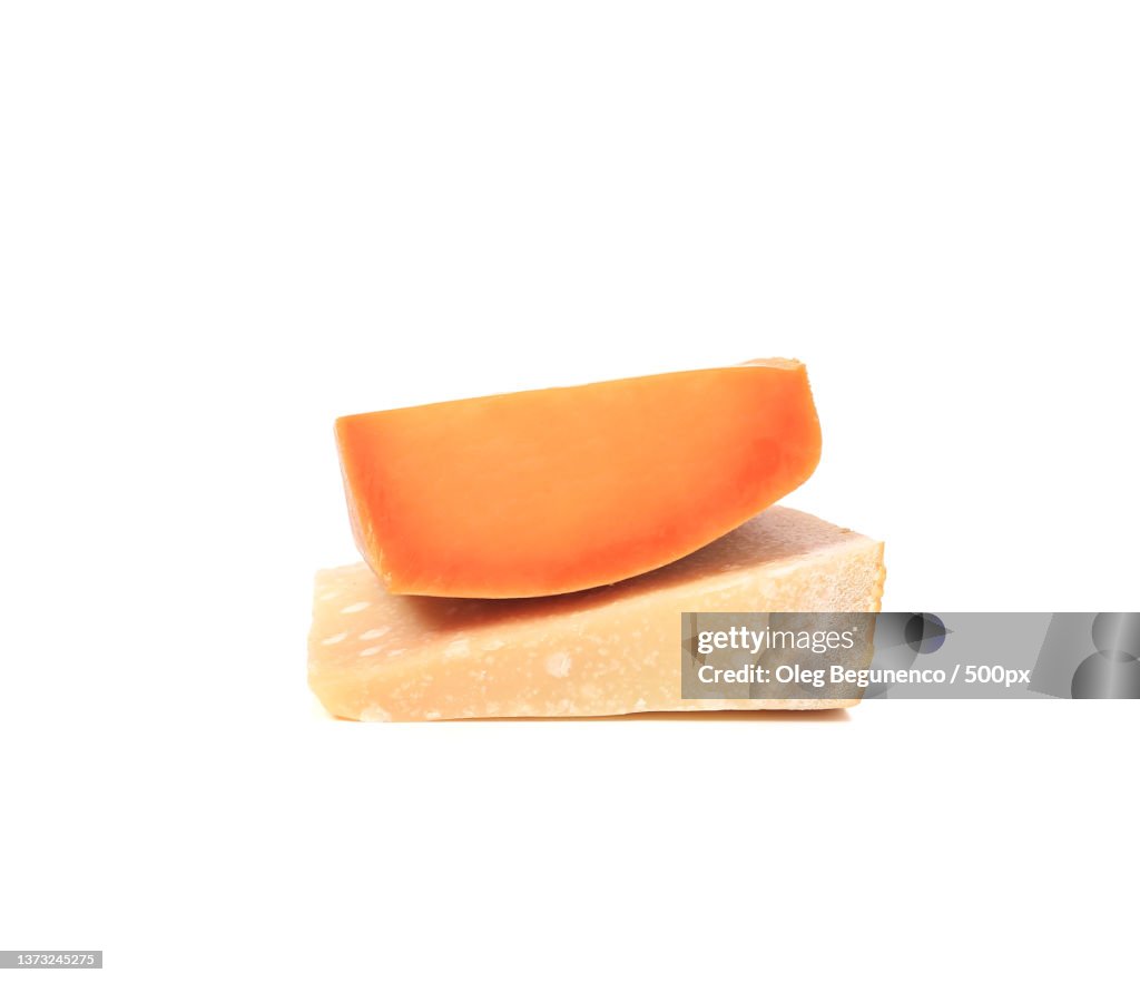 Close up of two cheese types,Close-up of cheese slice against white background,Moldova