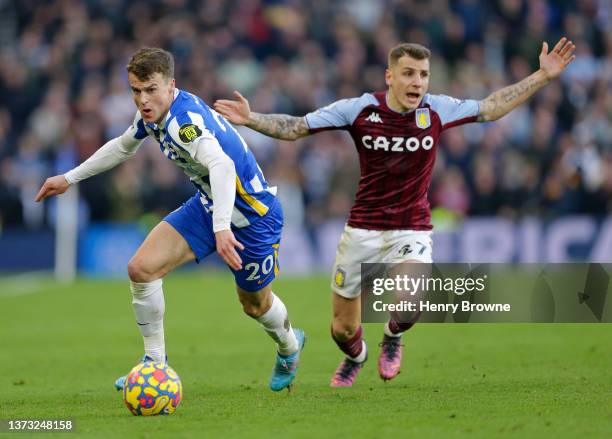 Lucas Digne of Aston Villa and Solly March of Brighton & Hove Albion during the Premier League match between Brighton & Hove Albion and Aston Villa...