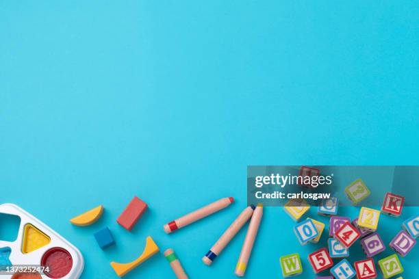 educational toys with copy space on bluish background - crayola stock pictures, royalty-free photos & images