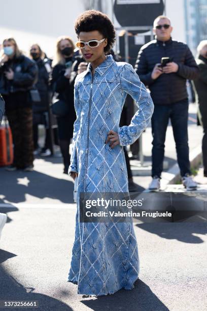 Lorena Cesarini poses ahead of the Diesel fashion show wearing a denim long coat with zipper during the Milan Fashion Week Fall/Winter 2022/2023 on...